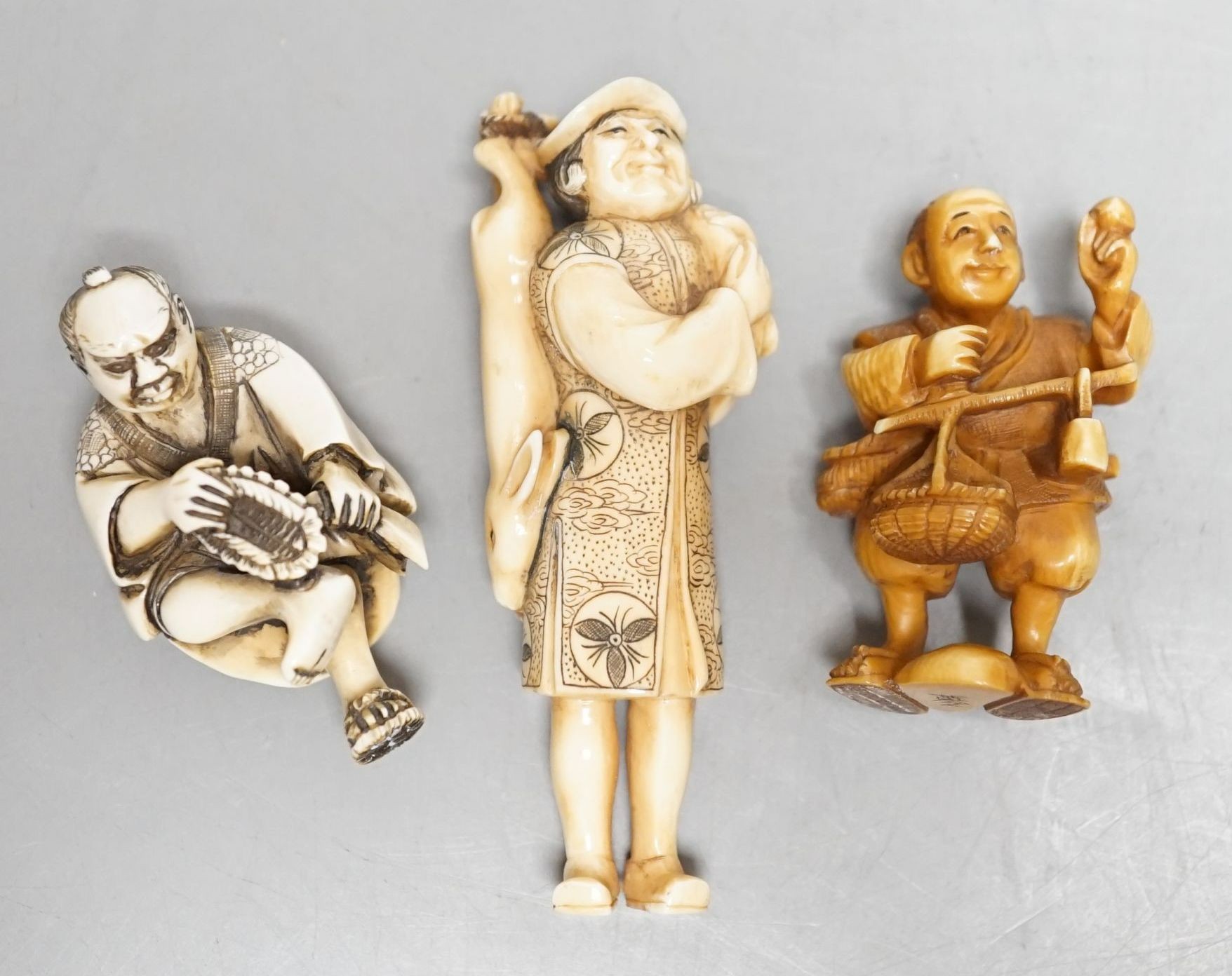 Three Japanese ivory netsuke of men, Taisho/early Showa period, signed - tallest 8cm